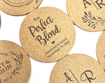May include: Set of six cork coasters with personalized text and designs. The coasters feature a variety of designs, including a couple's names and wedding date, initials, and a geometric design. The coasters are made of natural cork and have a rustic look.