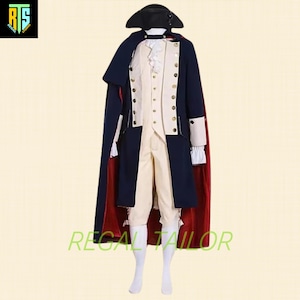 May include: A blue and white military-style coat with gold buttons and a red and blue cape. The coat has a white waistcoat and white trousers. The person is wearing a black hat.