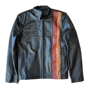 May include: Black leather jacket with a vertical stripe in red, tan, and orange. The jacket has a zip-up front, a stand-up collar, and multiple zippered pockets. A classic motorcycle-style jacket.