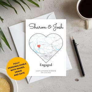 May include: A white card with a heart-shaped map, the names "Sharon & Josh", and the word "Engaged". The card includes the text "Loch Lomond, Scotland 15th June 2024". A yellow circle states "FULLY PERSONALIZABLE WITH NAMES, VENUE AND DATE".
