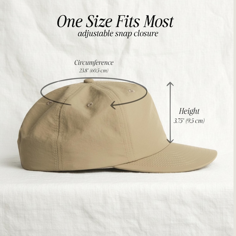 May include: A tan baseball cap with an adjustable snap closure. Text reads One Size Fits Most, adjustable snap closure. Dimensions are labeled as 23.8 inches circumference and 3.75 inches height. The cap features a structured crown and a curved brim.