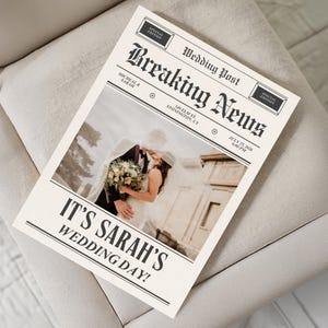 May include: A custom newspaper-style wedding announcement featuring the headline Breaking News and Wedding Post. The text reads Micheal & Sarah, 349 Elm St, Stonington, CT, July 25, 2026, 6:00 PM, and It's Sarah's Wedding Day! with a central photo of a couple.