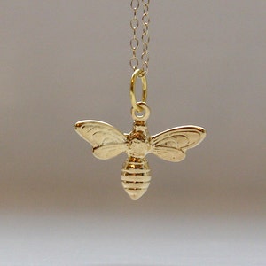 Tiny bee necklace in gold image 1