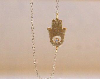 Zijwaartse hamsa handketting in goud