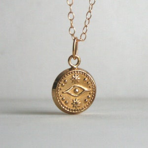 Evil eye charm necklace in gold