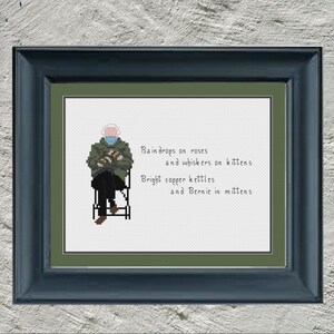 May include: A cross-stitch pattern featuring a man wearing a green jacket and a blue face mask, sitting on a chair. The pattern includes the text "Rain drops on roses and whiskers on kittens Bright copper kettles and Bernie in mittens".