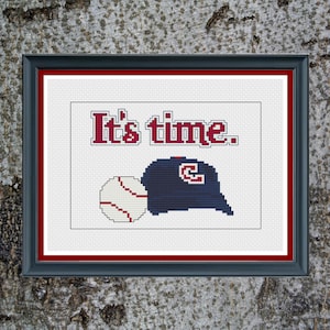 May include: Cross stitch pattern featuring a baseball cap with a "C" on it, a baseball, and the text "It's time."