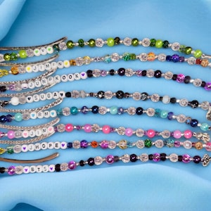 BTS inspired custom made beaded Bookmarks. Book is NOT included. This listing is for a Bookmark only. JungkooK,V,Jimin,RM,Suga,Jin,JHope.
