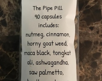 May include: A clear plastic resealable bag containing 90 brown capsules. The white label reads: DaHerbSpot, The Pipe Pill, 90 capsules includes: nutmeg, cinnamon, horny goat weed, maca black, tongkat ali, ashwagandha, saw palmetto, hawthorne berry.