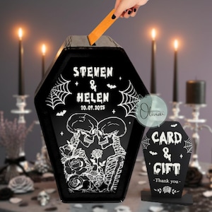May include: Black coffin-shaped card and gift box with white spiderwebs, bats, and the names "Steven & Helen" and date "20.09.2025". A matching sign reads "Card & Gift - Thank you-".