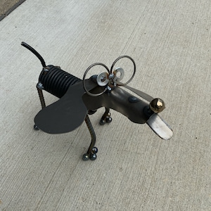 Dog Recycle Garden Sculpture garage door spring