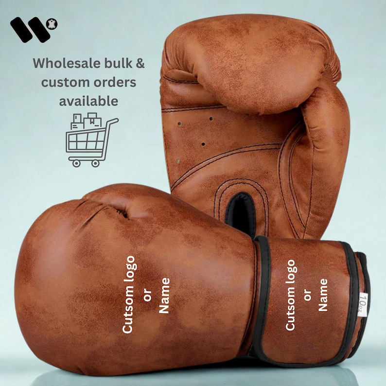 May include: Brown leather boxing gloves with black trim. The gloves have the text "Cutsom logo or Name" on the wrist strap. The text "Wholesale bulk & custom orders available" is also visible.