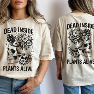 May include: A set of three ceramic mugs with a speckled, matte finish. The mugs are in shades of cream, light gray, and dark gray. Each mug has a simple, modern design, perfect for coffee or tea.