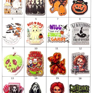 May include: A collection of sixteen decorative acrylic charms featuring various Halloween and horror-themed designs, including ghosts, witches, pumpkins, movie characters, and text-based graphics like Cereal Killers and Beetlejuice.