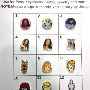 May include: A collection of twelve double-sided acrylic beads arranged in a grid, featuring various cartoon and pop culture character illustrations. Each bead measures approximately 0.75 by 1 inches, with designs including faces, figures, and hand gestures.