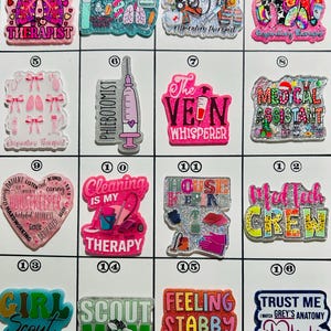 May include: A collection of colorful acrylic pins with various medical and hobby-related themes. Designs include medical professions like respiratory therapist, phlebotomist, and medical assistant, along with phrases like "Cleaning is my therapy" and "Feeling stabby today."