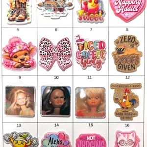 May include: A collection of colorful, decorative charms with various designs. Includes a cowboy boot with flowers, a bow with a leopard print, and a heart with the text "Napping Addict".