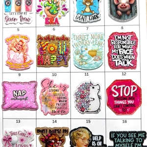 May include: A collection of sixteen rectangular acrylic badges arranged in a grid, each featuring unique colorful illustrations and text including phrases like 'Nap enthusiast', 'Stop stressing', 'Thrift more', and 'Help is on the way dear'.