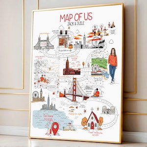 Op de afbeelding: Een ingelijste kaartillustratie getiteld "Map of Us" met de namen "Jack & Juile". De kaart toont handgetekende bezienswaardigheden, een route en tekst, waaronder "Our Home 17-2-2025" en "Chapel - Wedding Day 26-5-2024". Het kunstwerk zit in een gouden lijst.
