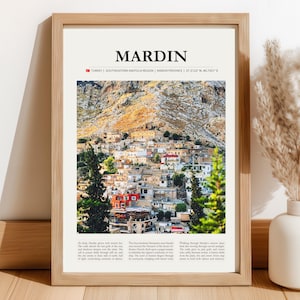 May include: A framed print featuring the word "MARDIN" at the top, with a photograph of a city nestled in a mountainous region. The print includes text indicating the location as Turkey, Southeastern Anatolia Region, and Mardin Province.