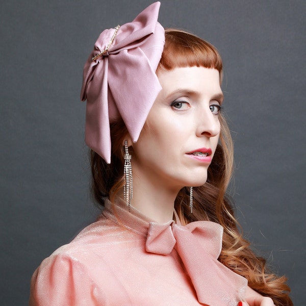 Pink velvet fascinator hat with oversized statement bow and vintage diamanté buckle