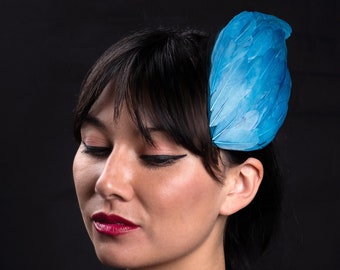 Turquoise blue feather wing mini hat or fascinator headpiece