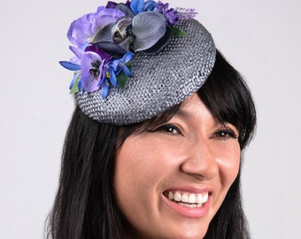 Blue, purple and grey mixed flower button hat, silver straw mini beret, pretty florals fascinator for events, ladies days.