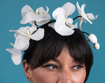 White orchid hair band - pin up, bridal or wedding floral fascinator on black Alice band