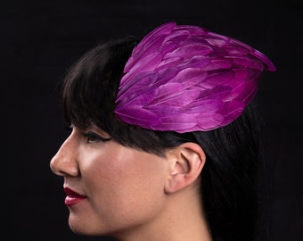 Purple feather wing mini hat or fascinator headpiece