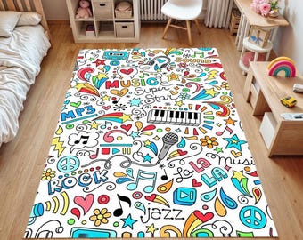 May include: A rectangular white rug with a colorful music-themed design. The rug features musical notes, stars, hearts, and the words "Music", "Rock", "Jazz", and "Super Star". The design includes a piano keyboard, microphone, and rainbow accents.
