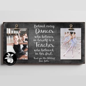 May include: A wooden framed photo display with two images of young ballet dancers. The text reads "Behind every Dancer who believes in herself is a Teacher who believed in her first."