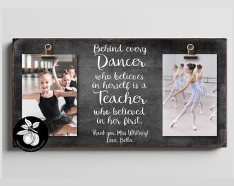 May include: A wooden framed photo display with two images of young ballet dancers. The text reads "Behind every Dancer who believes in herself is a Teacher who believed in her first."