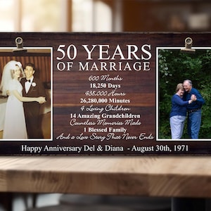 May include: A wooden sign with two photos of a couple celebrating their 50th wedding anniversary. The sign reads "50 Years of Marriage" and lists the number of months, days, hours, and minutes they have been married. It also mentions the number of children and grandchildren they have. The sign is personalized with the couple's names and the date of their anniversary.