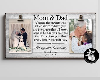 May include: A white wooden sign with a black border and two photos of a couple. The top photo shows the couple on their wedding day, and the bottom photo shows them kissing. The sign has the text "Mom & Dad" and "Happy 60th Anniversary" with the couple's names and wedding date.