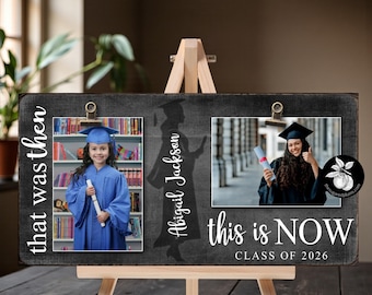 May include: A wooden graduation photo display with two photos, one labeled "that was then" and the other "this is NOW CLASS OF 2026". The display includes the name "Abigail Jackson" and is mounted on a small wooden easel.