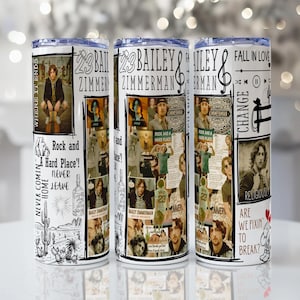 May include: Three white insulated tumblers with a collage design featuring the text "23 Bailey Zimmerman" and various images. The tumblers also include the phrases "Rock and Hard Place!" and "Never Comin Home."