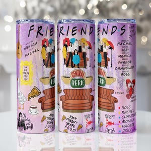 May include: Three stainless steel tumblers with a Friends theme. The tumblers feature the show's logo, character illustrations, and iconic elements like the Central Perk couch and lobster. The background is a gradient of purple and pink.
