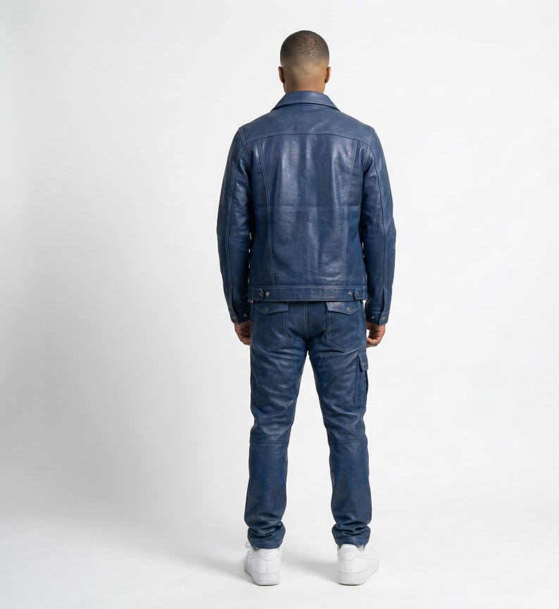 May include: A blue leather jacket and matching jeans. The jacket has a classic collar and button closure. The jeans have cargo pockets. The outfit is a solid blue color.