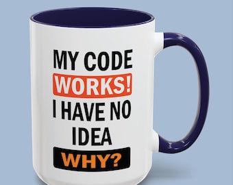 May include: A white ceramic mug with a dark blue interior and handle. The front features black text that reads MY CODE WORKS! with the word WORKS! in an orange box, followed by I HAVE NO IDEA and the word WHY? in an orange box on a black background.