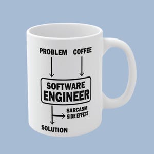 May include: A white ceramic mug featuring a black graphic diagram. The text reads: PROBLEM and COFFEE pointing into a box labelled SOFTWARE ENGINEER, with an arrow pointing down to SOLUTION and a side arrow labelled SARCASM SIDE EFFECT.
