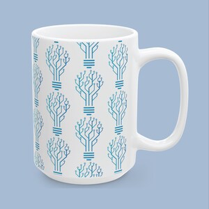 May include: A white ceramic mug featuring a repeating pattern of blue light bulb icons. Each light bulb is constructed from a series of interconnected lines and dots that resemble a printed circuit board design, arranged in a vertical grid.