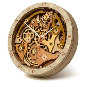 May include: Wooden wall clock with exposed gears and Roman numerals. The clock features a layered design with visible gears in shades of gold and brown. The clock face has the text "Craftco".