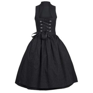 May include: A black dirndl dress with a white polka dot pattern. The dress has a fitted bodice with a lace-up front and a full skirt.