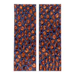 May include: Two rectangular panels with a mosaic pattern. The design features a network of blue lines enclosing organic shapes in shades of brown and gold. The overall effect is reminiscent of a natural, textured surface.