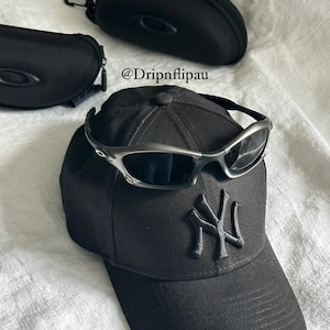 Vintage Oakley Sunglasses: Polished Silver Frame, Black Lenses with Case