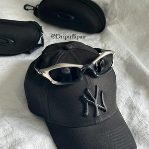 Oakley Sunglasses: Polished Silver Frame, Black Lenses - Vintage Collectible