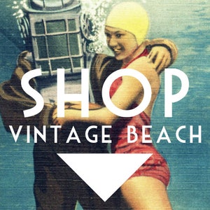 May include: Vintage-style image with the text "SHOP VINTAGE BEACH." The image features a diver in a vintage diving suit embracing a woman in a red swimsuit and yellow swim cap underwater. The background has a blue, textured appearance.