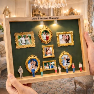 May include: A wooden framed display with multiple small gold ornate frames holding photographs. The display has miniature figures at the bottom and the text "Ozzy & Sevina's Memories" at the top.