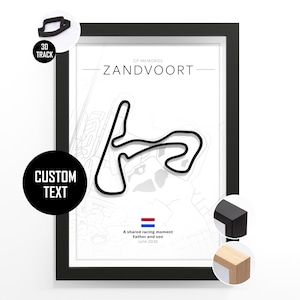 May include: Framed print featuring a black and white track layout of Zandvoort. The print includes the text "ZANDVOORT" and "A shared racing moment Father and son June 2016". The frame is black.