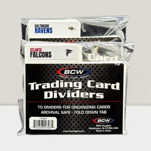May include: Packaged trading card dividers from BCW. The package includes dividers for the Baltimore Ravens and Atlanta Falcons. The packaging features the text "Trading Card Dividers" and "10 Dividers for Organizing Cards".